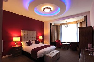 The Pearl Hotel in Peterborough, image may contain: Lighting, Lamp, Bed, Chair