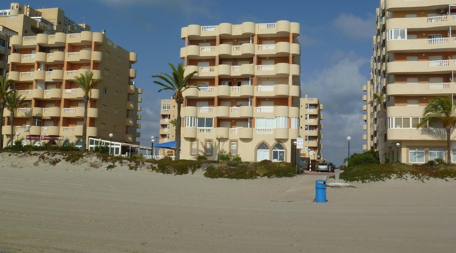 view of apt block from beach