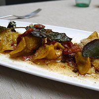 Pasta filled with spiced minced meat from the Bergamo area, Italian ham, sage and a butter sauce