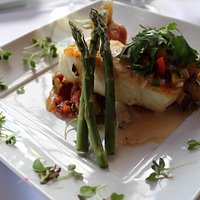 Chilean Sea Bass special with mango salsa, mashed potatoes and vegetables