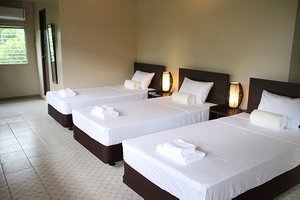 DW Motel in Koror Island, image may contain: Hotel, Resort, Bed, Furniture