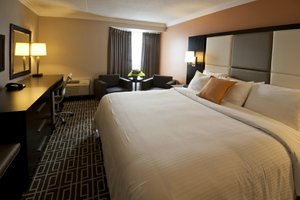 Visitors Inn in Hamilton, image may contain: Table Lamp, Lamp, Furniture, Bed