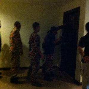 Friend took this photo of the firemen breaking down the door to rescue me.