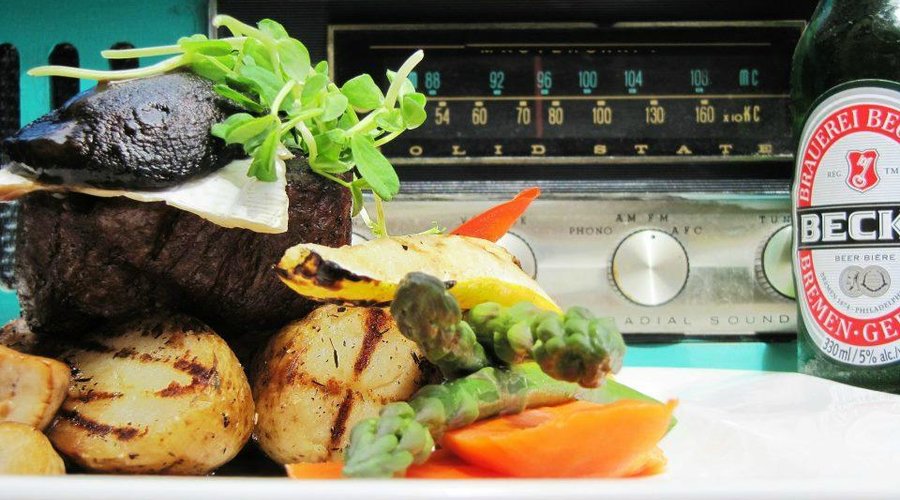 dinner feature beef tenderloin steak, topped with brie and portobello,  & a demi