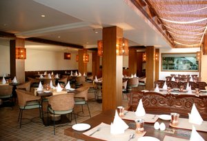 Hotel Palace Heights in New Delhi, image may contain: Restaurant, Dining Room, Dining Table, Cafe