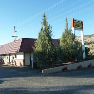 Sign and one of two buildings with rooms.