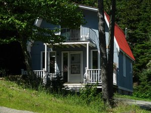 Bayview Chalets & Motel in Alma, image may contain: Porch, Housing, House, Cottage