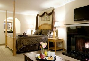 Stage Coach Lodge in Monterey, image may contain: Fireplace, Indoors, Monitor, Interior Design