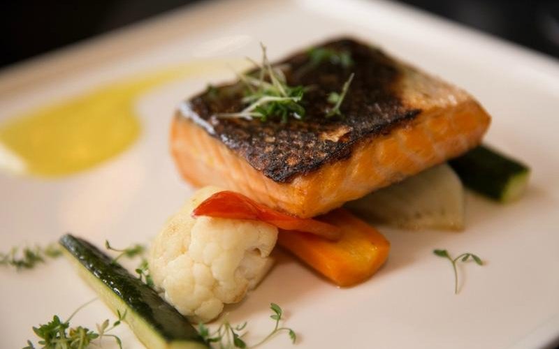 Salmon on veggies. Perfectly cooked.