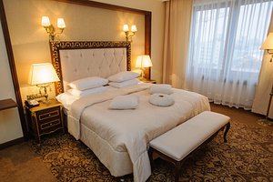 President Hotel Minsk in Minsk, image may contain: Furniture, Bed, Bedroom, Bench