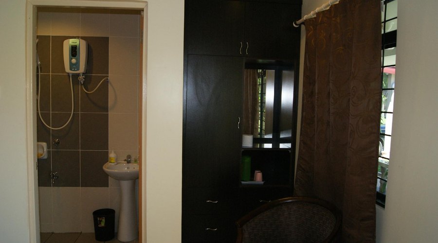 Bathroom with hot shower. Closet and water boiler for making hot drinks.