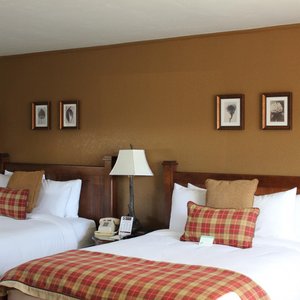 The Inn at Tomichi Village in Gunnison, image may contain: Cushion, Bed, Furniture, Painting
