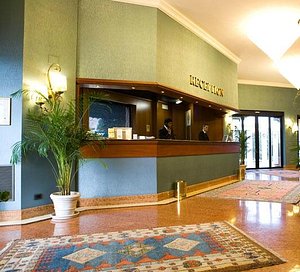 Hotel Motel Luna in Novegro, image may contain: Table, Plant, Reception, Foyer
