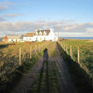 Th access road to the hostel (actual building behind the house)