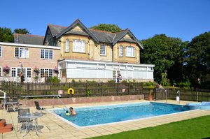 Luccombe Manor Country House Hotel in Isle of Wight, image may contain: Villa, Backyard, Grass, Pool