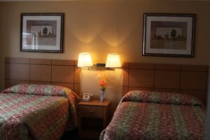 New Relax Inn in Bridgeview, image may contain: Lamp, Furniture, Bed, Table Lamp