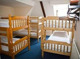 Berties Lodge in Newquay, image may contain: Furniture, Crib, Indoors, Hostel
