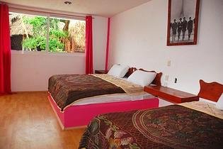Habitación doble con aire acondicionado.