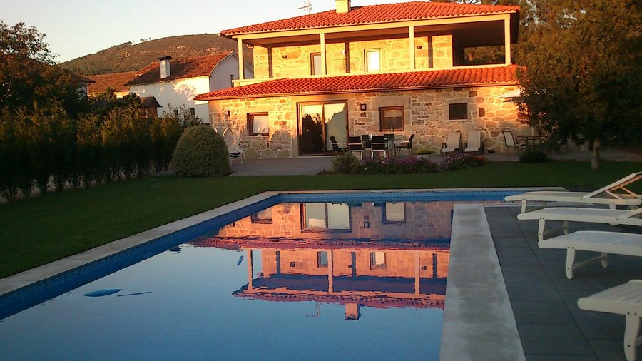 REAR OF HOUSE AND LOUNGE PATIO
