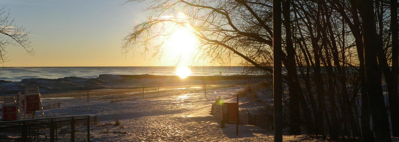 Sunrise in winter on Lighthouse beach Lake Michigan