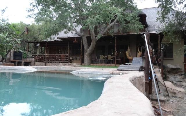 Rear view of the house and pool