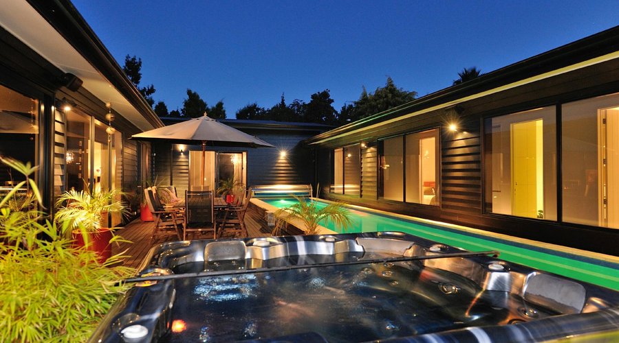 Central courtyard with outside lounge furniture, dining area, lap swimming and spa pool