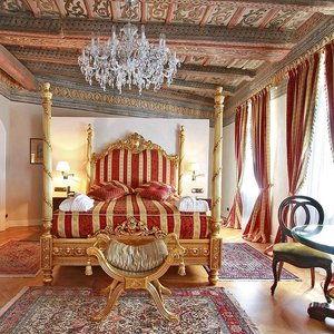 Alchymist Prague Castle Suites in Prague, image may contain: Furniture, Home Decor, Bedroom, Indoors