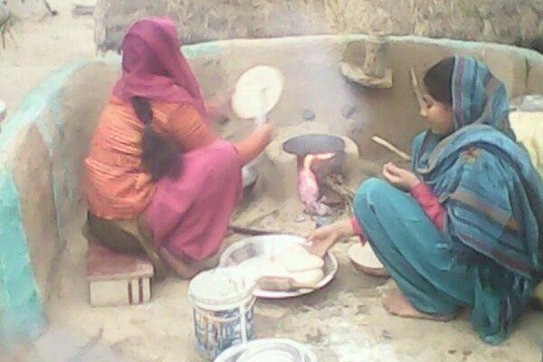 Village women cooking their meals!