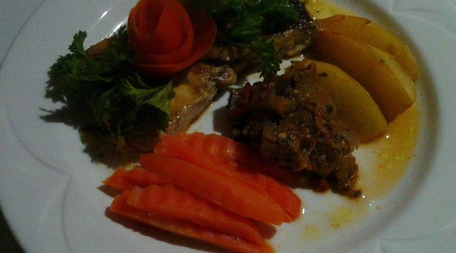 Fresh grilled fish, locally grown vegetables