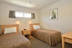 Senator Motor Inn in Gisborne, image may contain: Dorm Room, Bed, Furniture, Bedroom