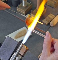 Melting glass in the flame