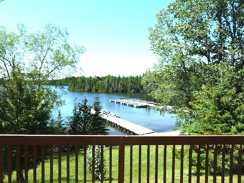 Enjoy this pristine atmosphere from your lakeside cabin at Fireside Lodge.