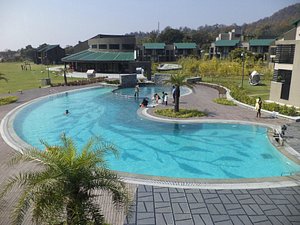 Namah Resort Jim Corbett, a member of Radisson Individuals in Dhikuli, image may contain: Hotel, Resort, Pool, Person