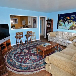 The "Upstairs" living room has a large flatscreen TV.