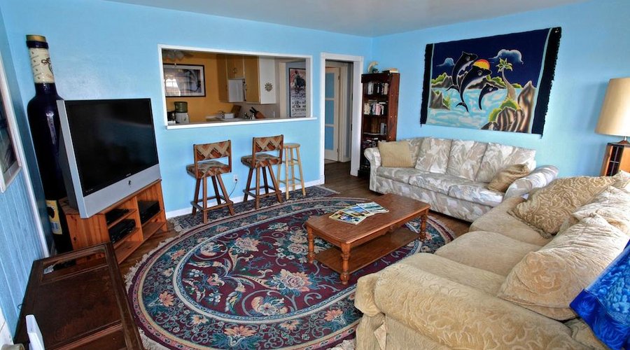 The "Upstairs" living room has a large flatscreen TV.