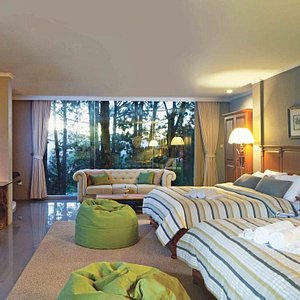 Sandalwood Boutique Hotel in Bandung, image may contain: Bed, Furniture, Chair, Home Decor