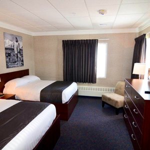 Top of the World Hotel in Utqiagvik, image may contain: Dorm Room, Furniture, Bedroom, Bed