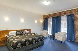 Yarra Valley Motel in Lilydale, image may contain: Furniture, Bed, Chair, Bedroom