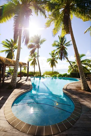 Tamanu Beach in Aitutaki, image may contain: Summer, Resort, Hotel, Pool