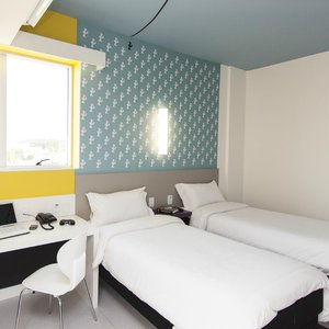 Nobile Inn Pampulha in Belo Horizonte, image may contain: Chair, Bed, Dorm Room, Laptop
