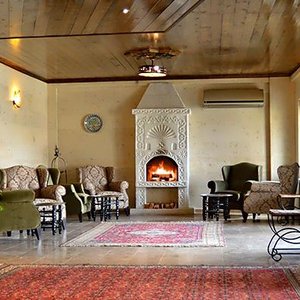 Osmanli Cappadocia Hotel in Goreme, image may contain: Interior Design, Wood, Furniture, Lamp
