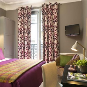 Le Petit Chomel in Paris, image may contain: Chair, Handbag, Lamp, Bed