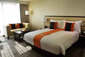 Limketkai Luxe Hotel in Mindanao, image may contain: Cushion, Home Decor, Furniture, Couch