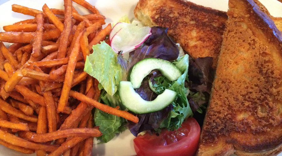 grilled cheese, sides of salad, sweet potato fries