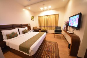Hotel Legend Inn in Nagpur, image may contain: Monitor, Screen, Computer Hardware, TV