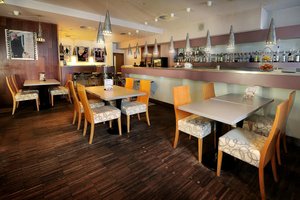Hotel Biograf in Pisek, image may contain: Restaurant, Dining Room, Dining Table, Cafe