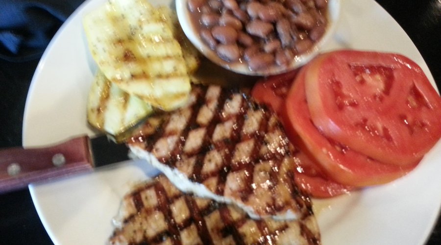 Pork loin, pintos, wood grilled squash, and  Grainger Co. tomatoes