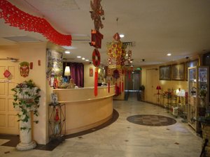 Hotel Star Town Inn in Kuala Lumpur, image may contain: Floor, Flooring, Table, Reception