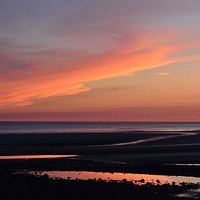 Midsummer sunset over Earnse Bay from West Shore.