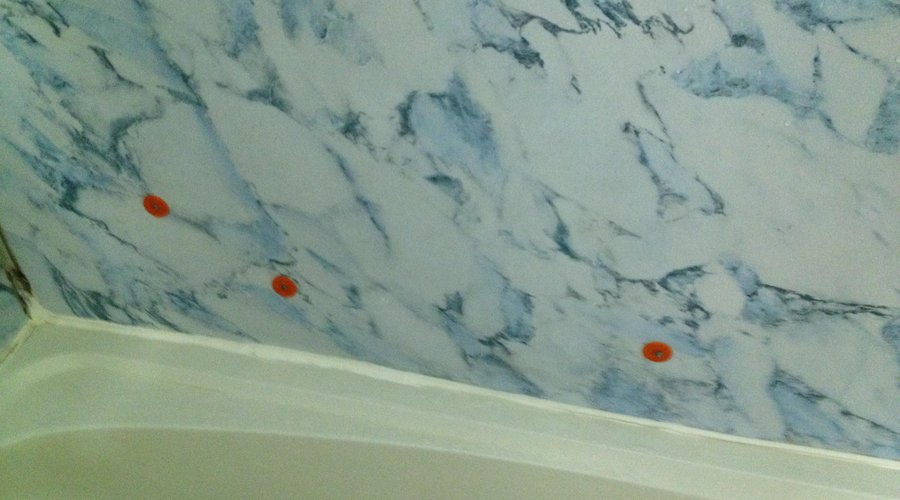 Tub enclosure attached w/roofing nails